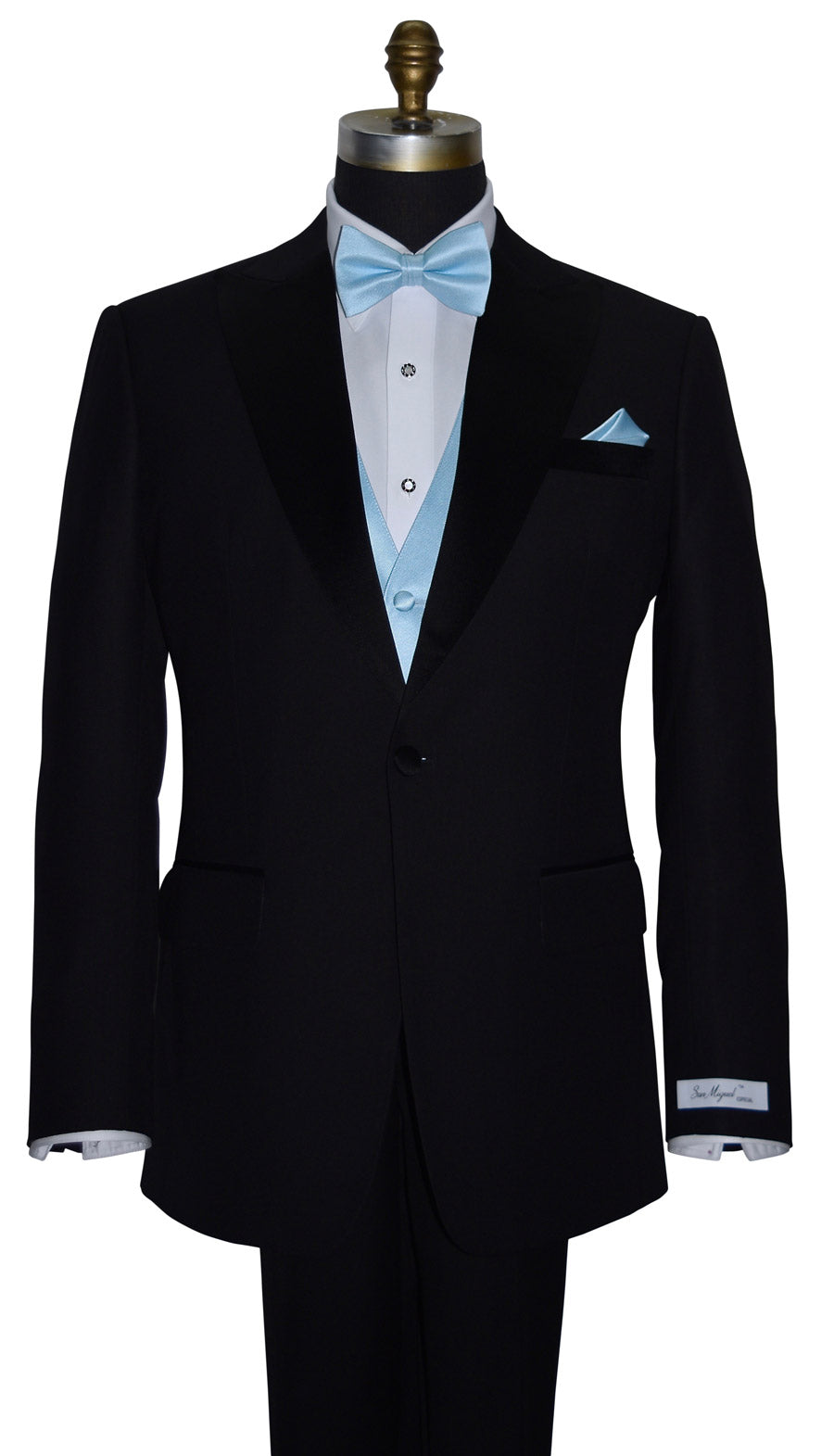 close-up front view-mannequin wearing a "San Miguel Especial" black peak-lapel tuxedo with a white dress shirt and a capri-blue tuxedo vest and  capri-blue "pre-tied" bowtie and pocket handkerchief against a white background
