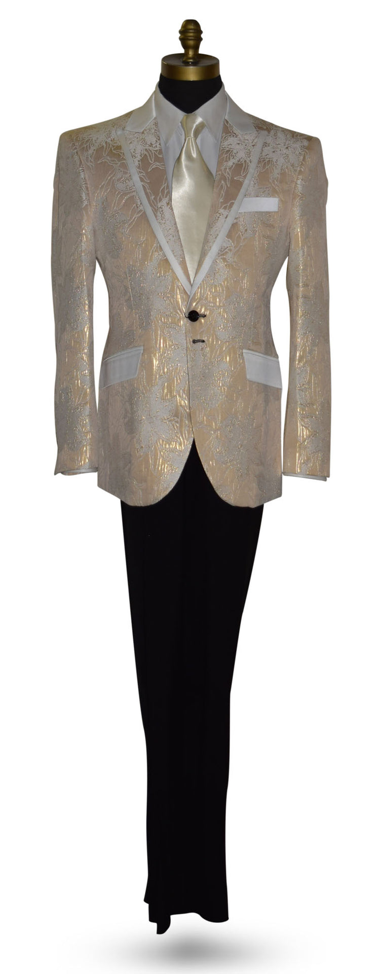 Champagne color tuxedo with satin trim on the peak lapels shown with black pants and a off-white satin necktie on a mannequin against a white background