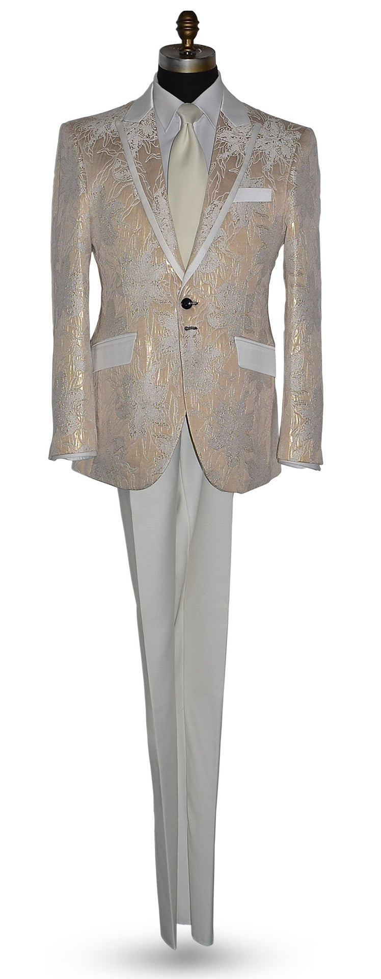 Champagne color tuxedo with satin trim on the peak lapels shown with ivory pants and an ivory necktie on a mannequin against a white background