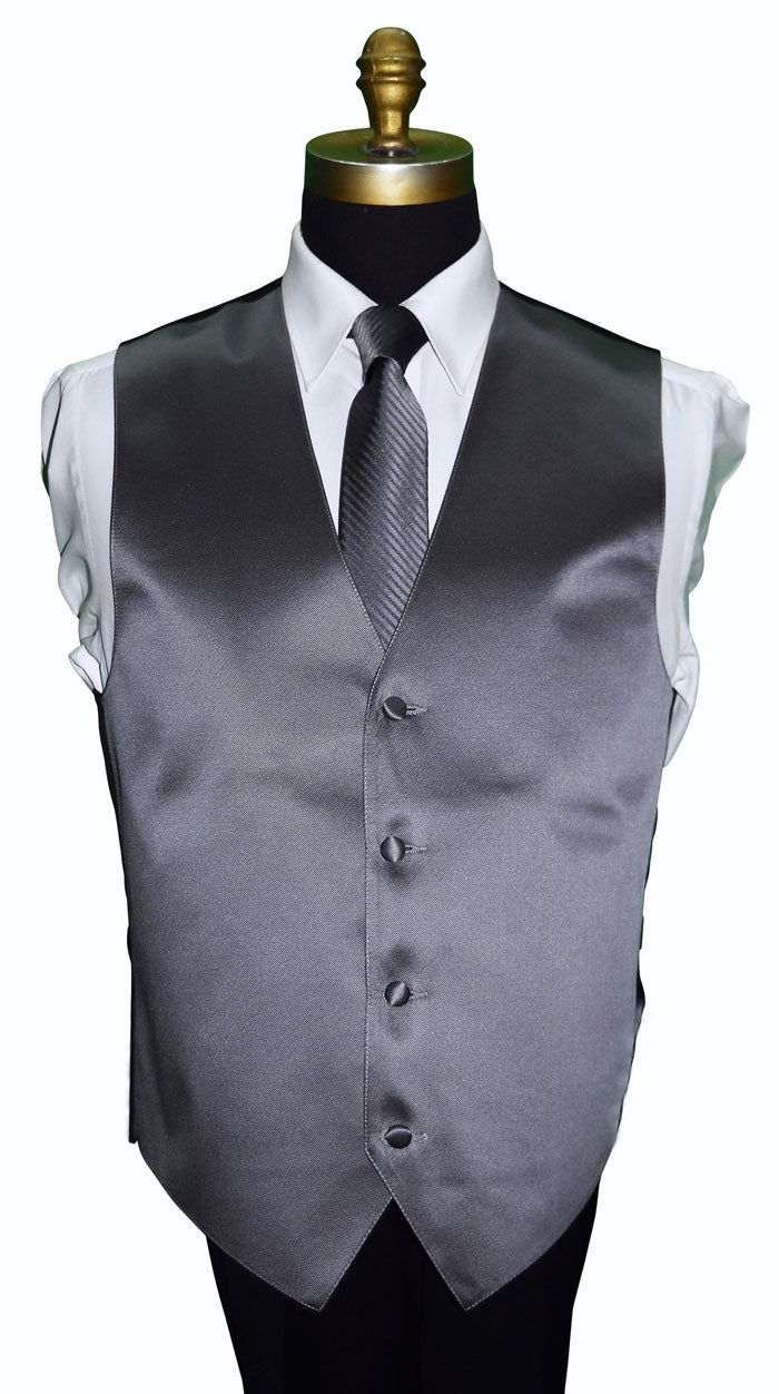 Charcoal gray tuxedo vest with a charcoal necktie with subtle stripe on a mannequin against a white background