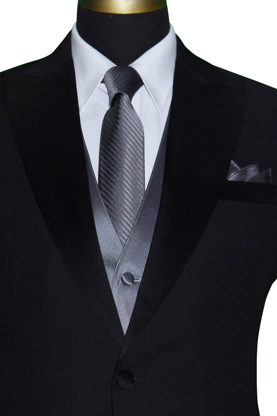 close-up-mannequin wearing a black peak-lapel tuxedo with a charcoal tuxedo vest and long charcoal necktie with subtle stripe against a white background