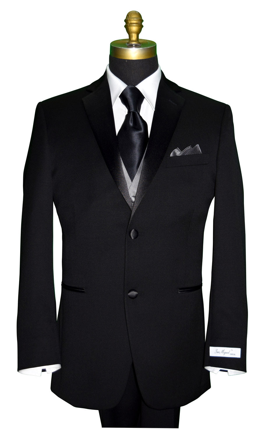Black "San Miguel Especial" wedding suit on a mannequin with a white shirt and long black silk necktie with a charcoal tuxedo vest against a white background