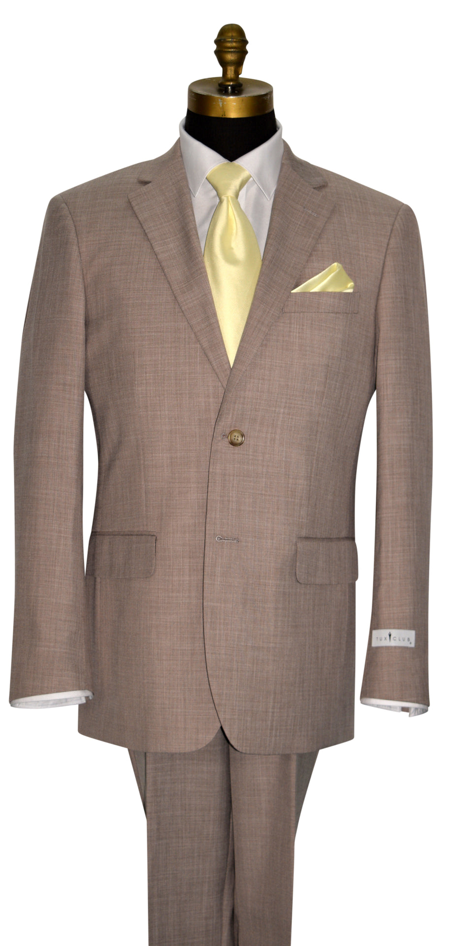 close-up mannequin wearing a brown men's suit with a yellow necktie against a white background