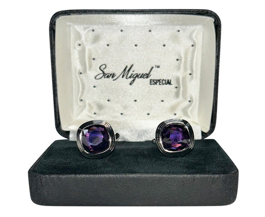 Purple gemstone cufflinks in a San Miguel box on a white background