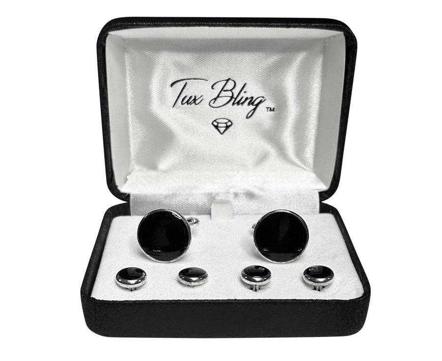 close up Black with silver setting cufflinks and studs set in a 'Tux Bling' box on a white background