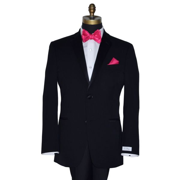 mannequin wearing a black tuxedo with a white tuxedo shirt and a hot-pink silk "tie-yourself bowtie with a hot-pink matching pocket handkerchief against a white background