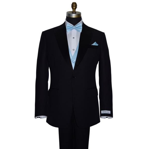 front view Black tuxedo with "San Miguel Especial" branded label wearing a capri-blue bow tie and pocket square on a mannequin against a white background