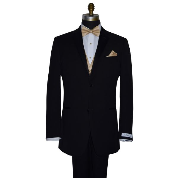 black tuxedo wearing a tuxedo shirt with a golden "pre-tied" bowtie and vest with black tuxedo pants against a white background