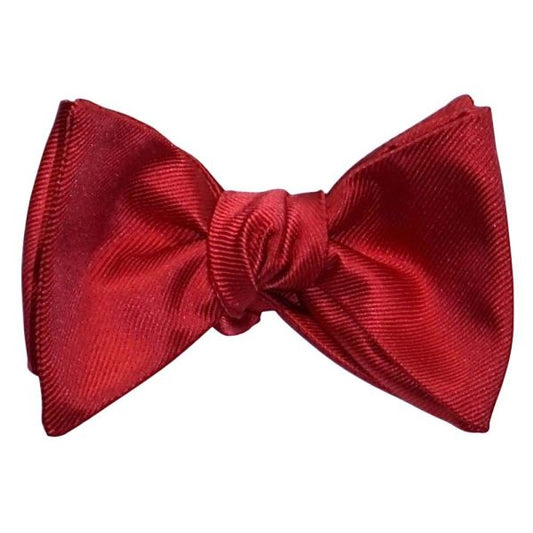 red self-tie bowtie against a white background