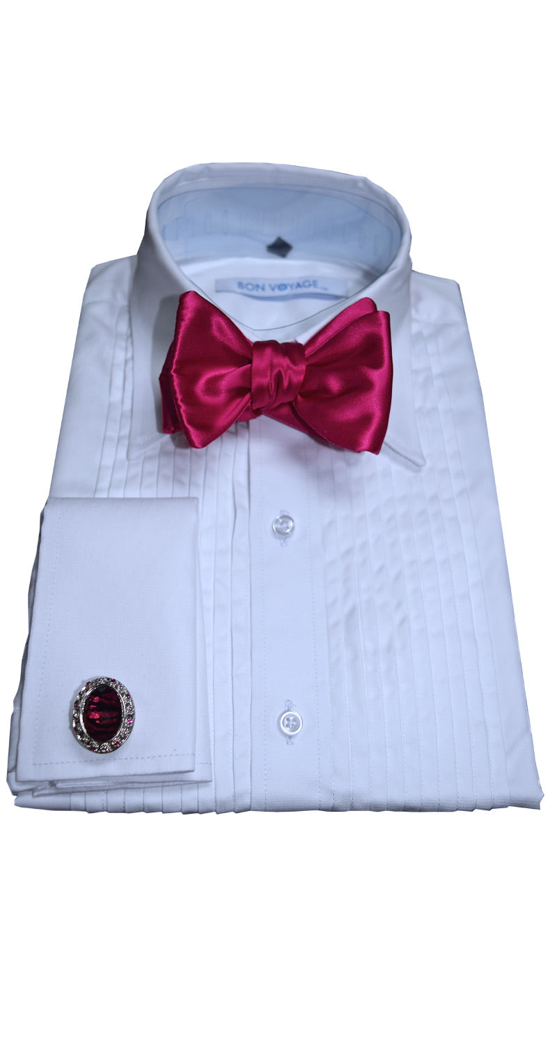 White tuxedo shirt with a hot-pink silk "tie-yourself" bow tie and cufflink on a white background