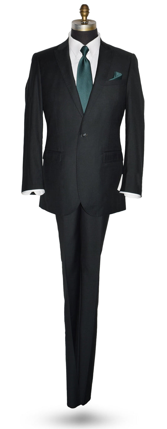 Life size mannequin wearing a men's hunter green suit coat and matching pants with a white dress shirt and green necktie in-front of a white background