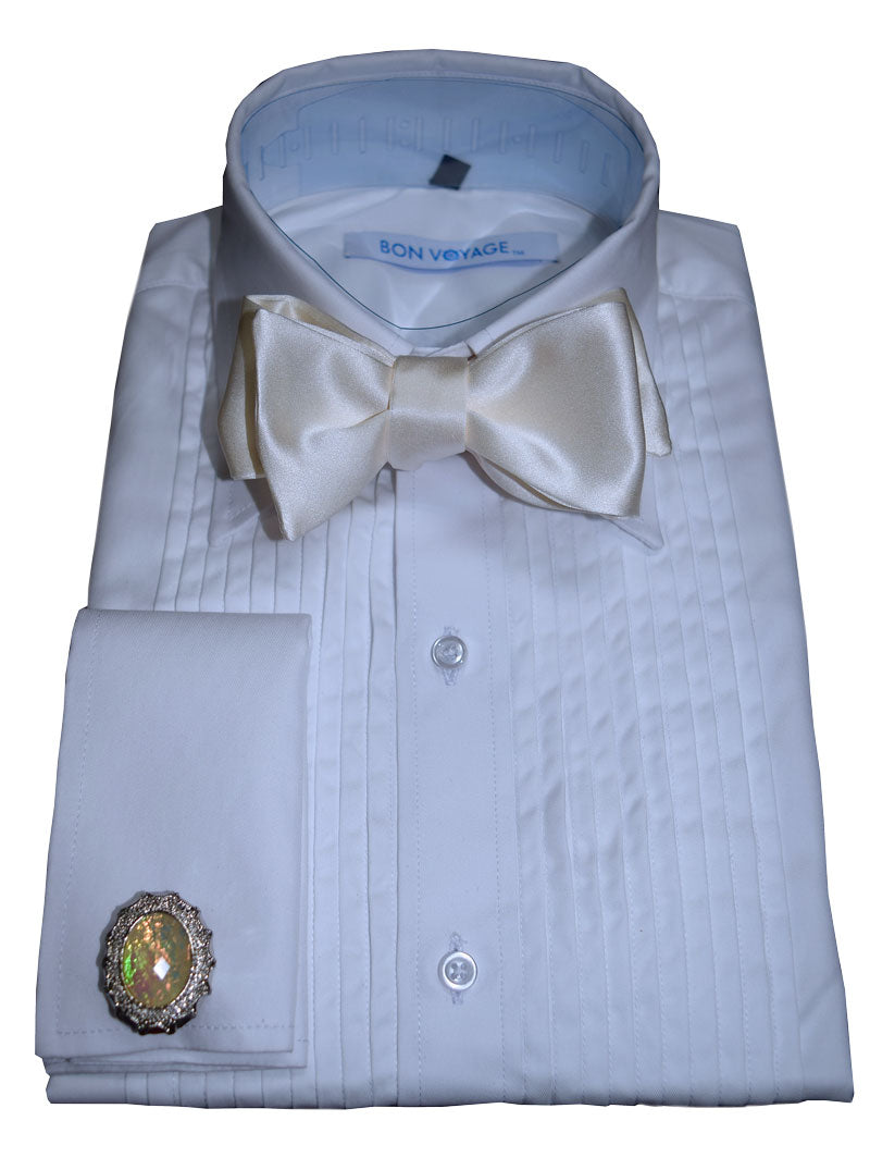 white tuxedo shirt wearing an ivory "self-tie" bow tie against a white background