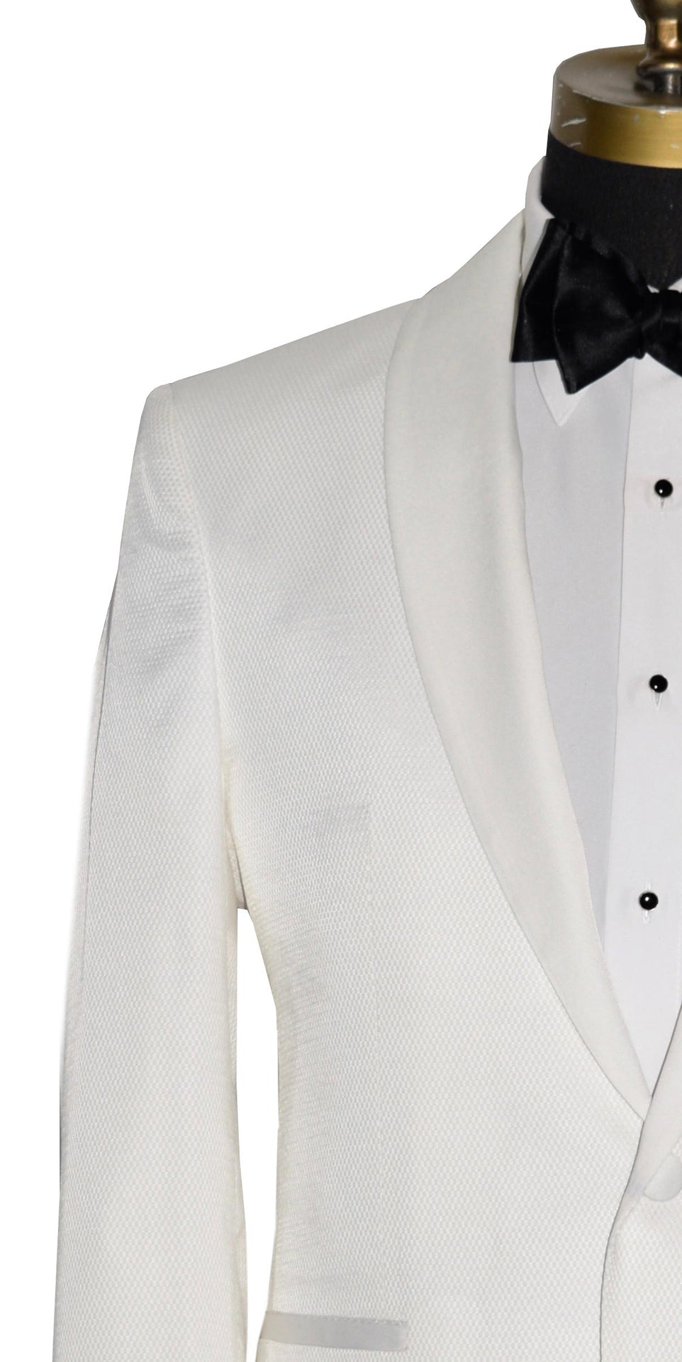 close-up mannequin wearing an ivory shawl collar tuxedo with a white tuxedo shirt and a black  tie-yourself bowtie against a white background