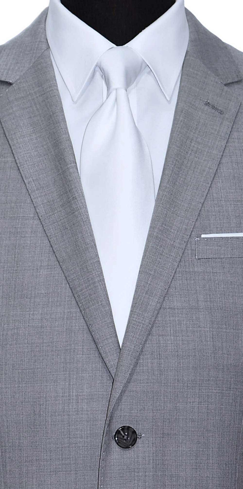 very close-up Life size mannequin wearing a light gray mens suit  with a white dress shirt and a white sating necktie against a white background