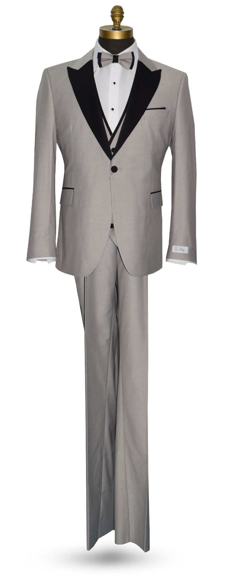 life size mannequin wearing light gray peak lapel tuxedo with matching gray vest and gray bow tie against a white background