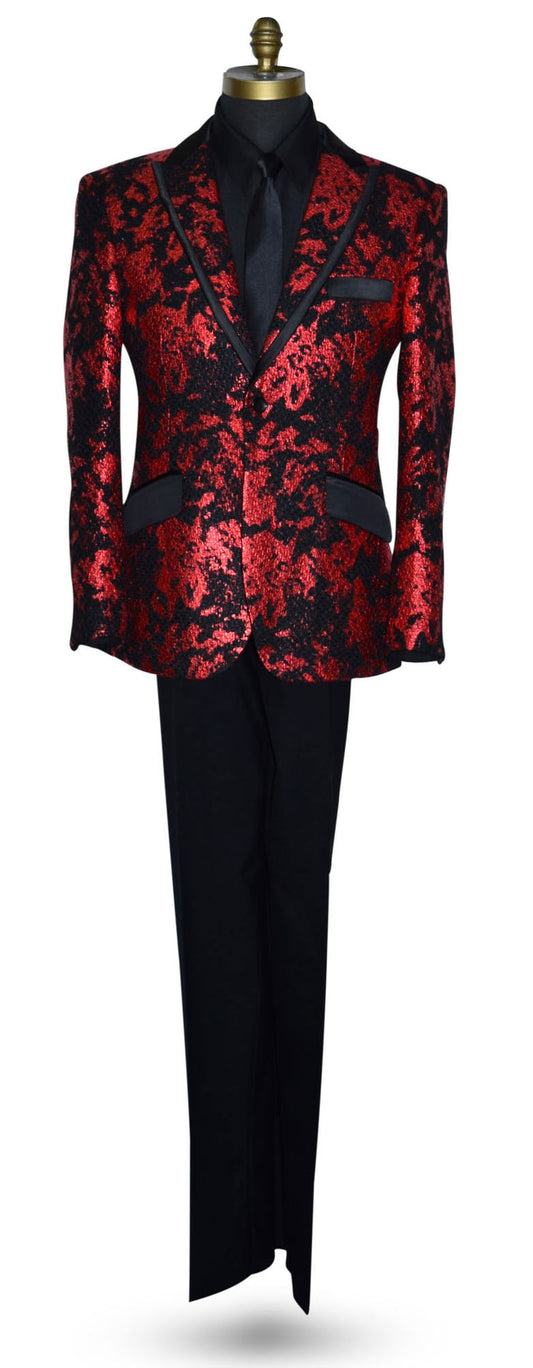 Red and black patterned tuxedo jacket on a mannequin with black tuxedo pants and a black tuxedo shirt with a long black skinny necktie against a white background