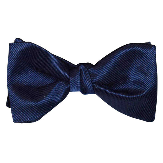 Marine blue bow tie on a white background