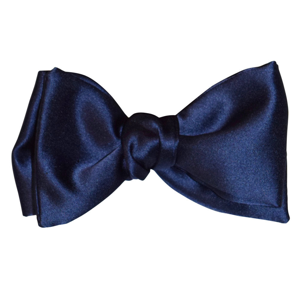 Navy blue satin "tie-yourself" bow tie on a white background
