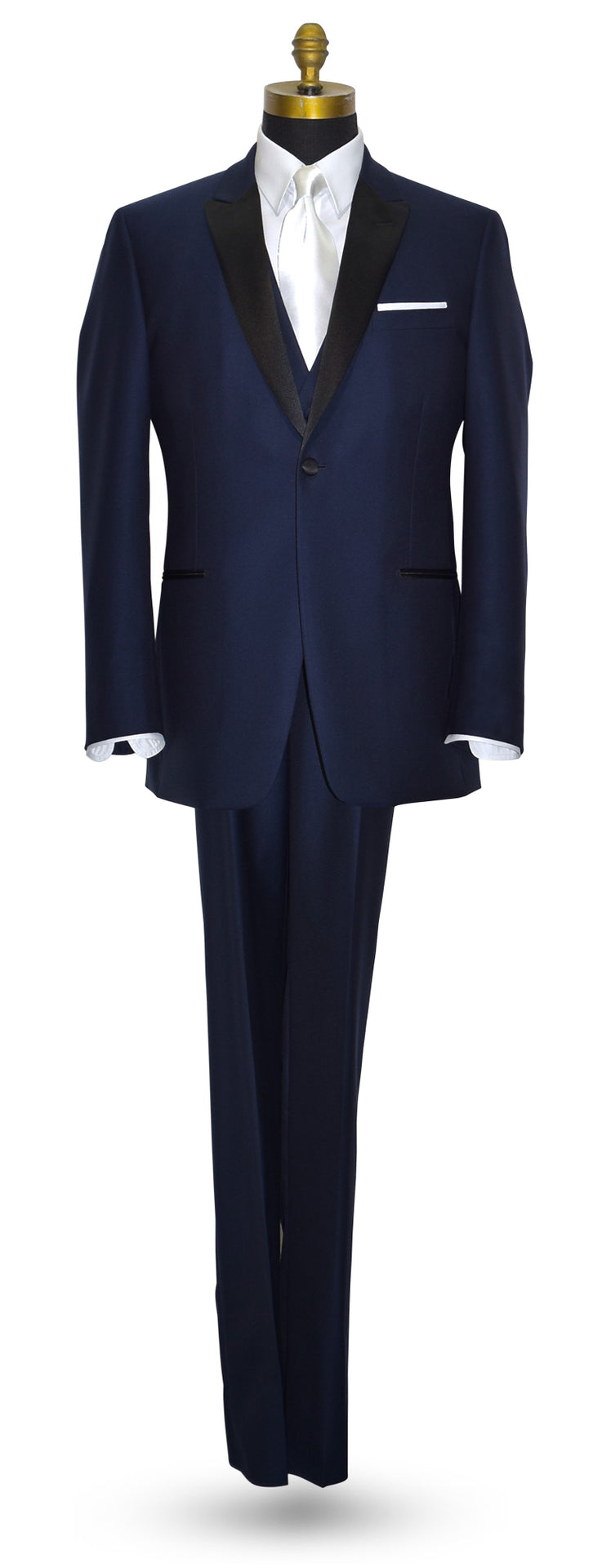 Navy blue tuxedo with a navy blue wool tuxedo vest and a long white necktie on a mannequin against a white background