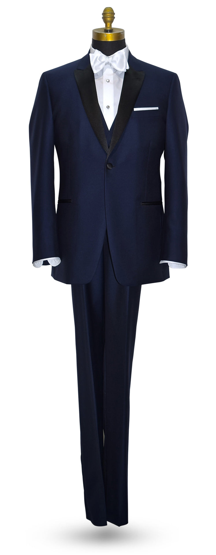 Navy blue tuxedo with white shirt and a navy blue wool tuxedo vest on a mannequin against a white background