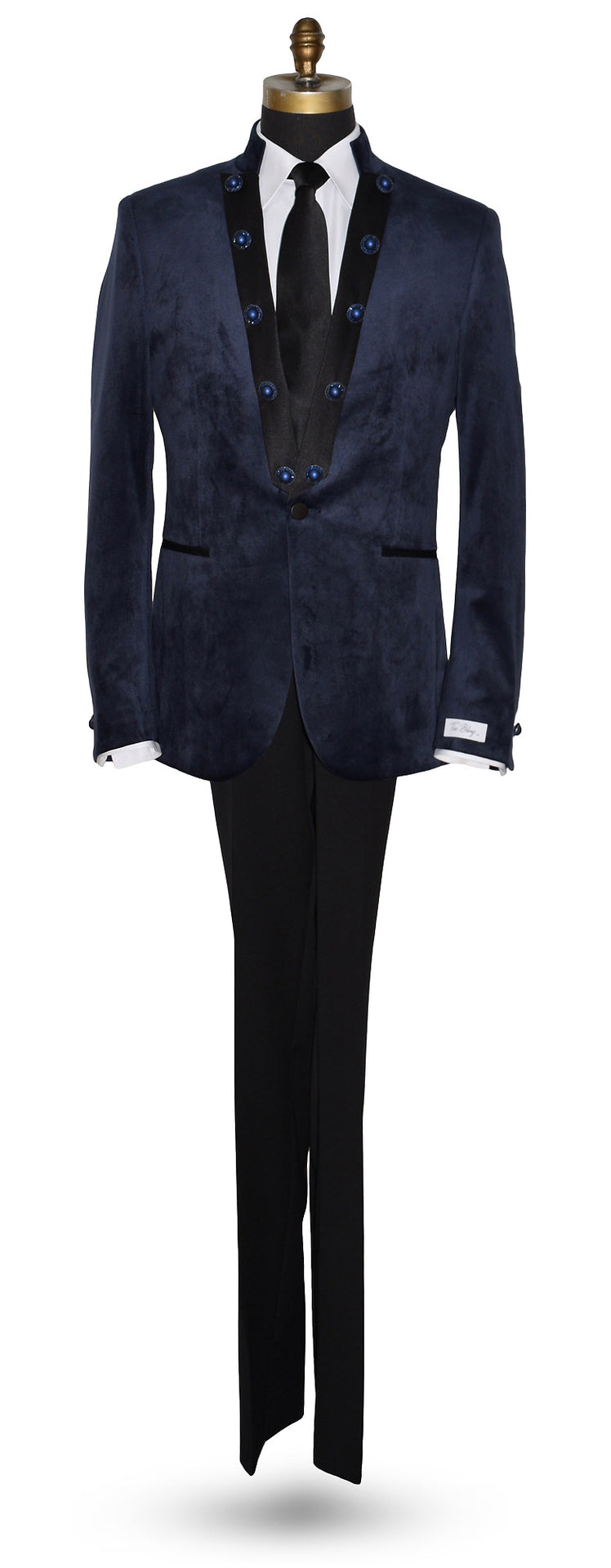life size mannequin wearing a navy velvet nehru collar tuxedo with a long black dress tie against a white background