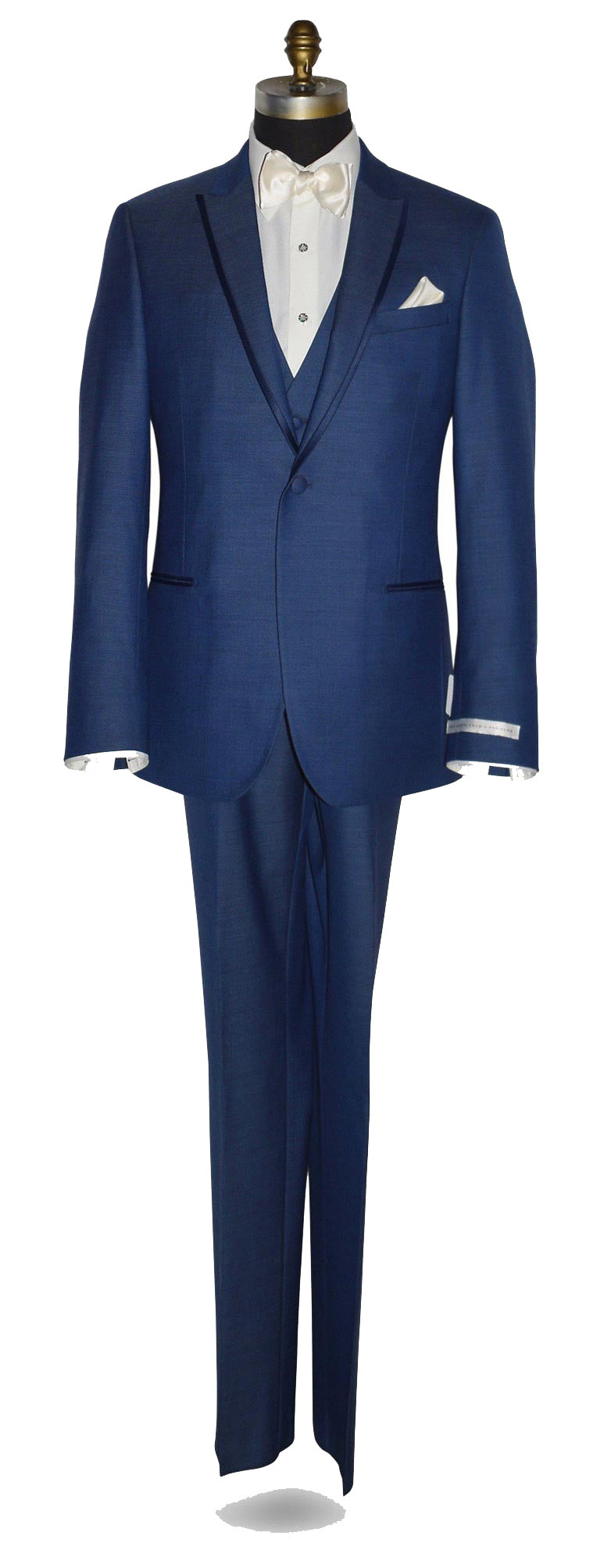 life-size mannequin wearing a "new blue" tuxedo with the matching new-blue tuxedo vest shown here with an ivory dress shirt and an ivory "tie-yourself" bowtie against a white background