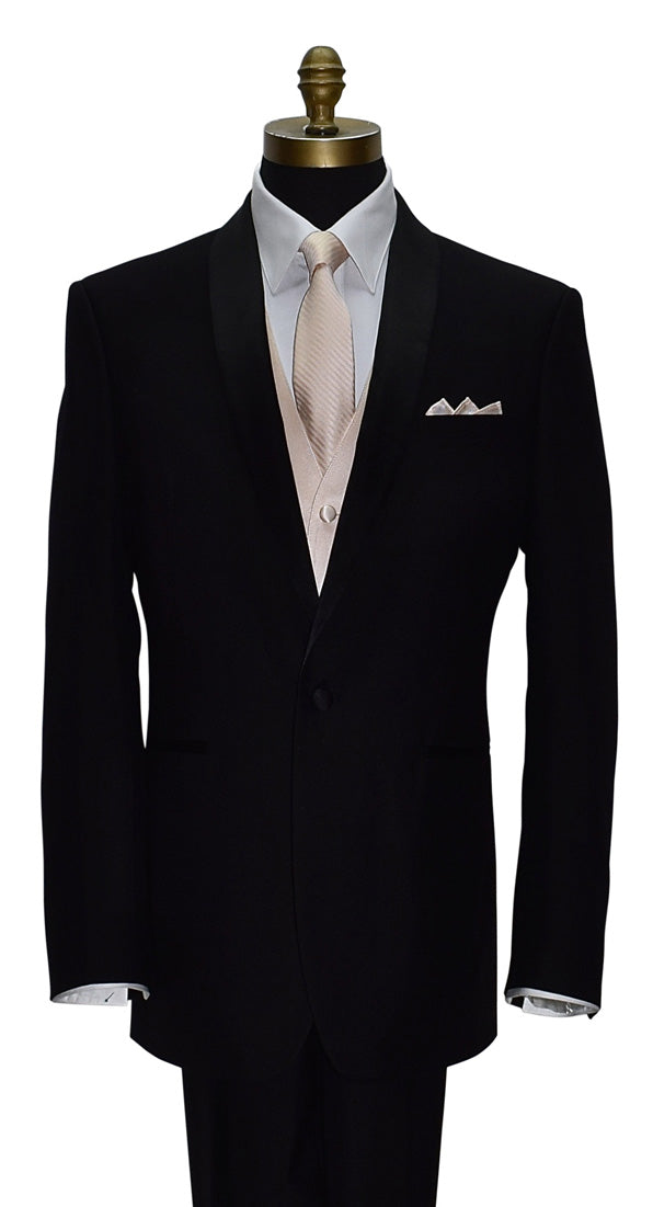 Black shawl-collar tuxedo with white shirt and nude tuxedo vest and nude necktie on a mannequin against a white background