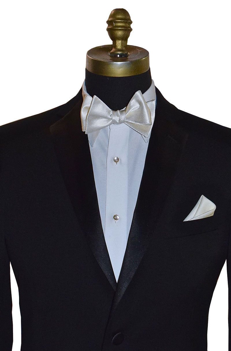 close-up mannequin wearing a black tuxedo with a white tuxedo shirt and an off-white piques tie-yourself bowtie