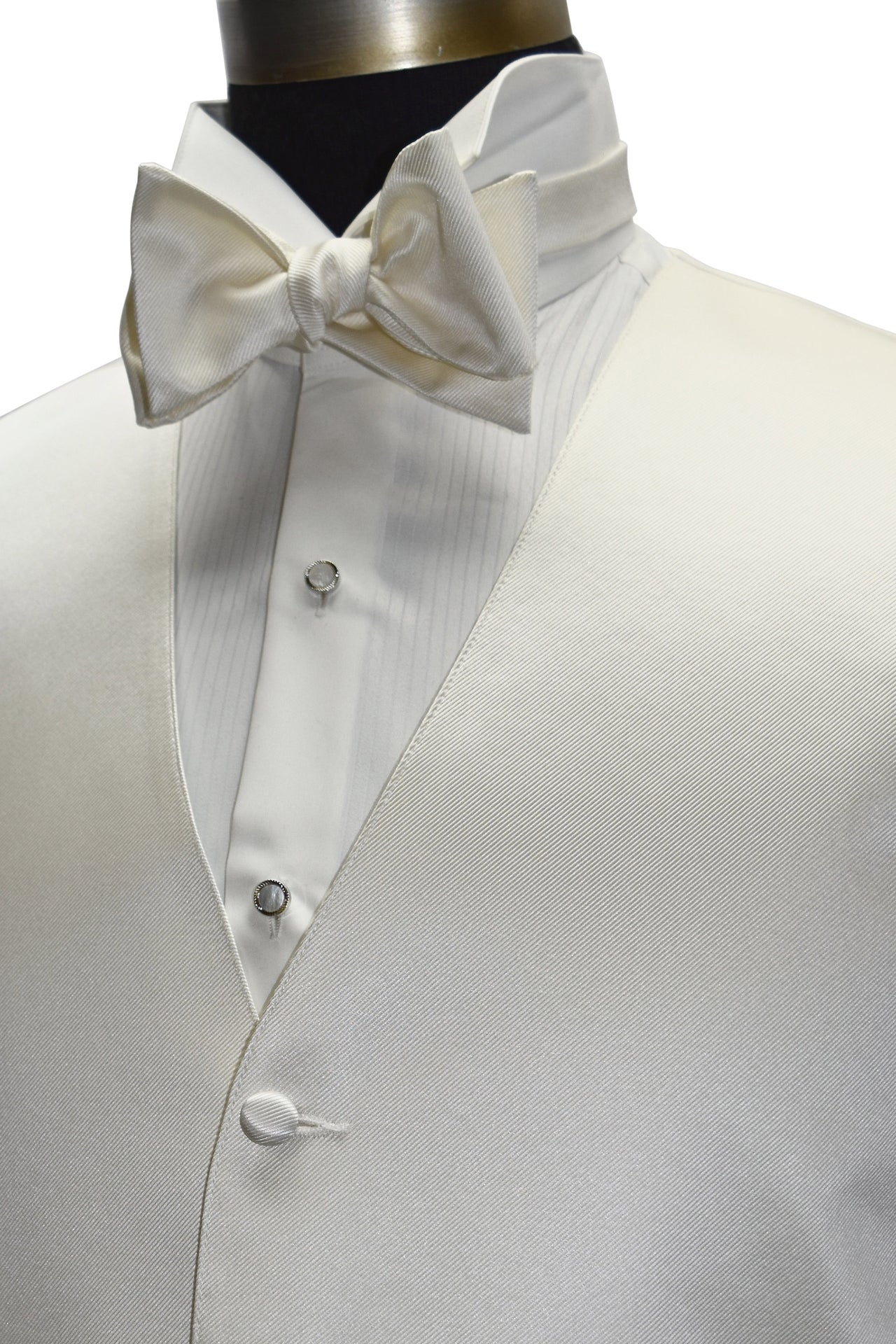 close-up side view - off-white tuxedo vest with an off-white "tie-yourself" bowtie on a mannequin against a white background