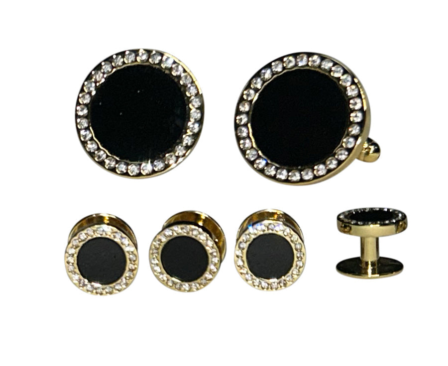 close up of onyx cufflinks and studs with crystals in a gold setting against a white background
