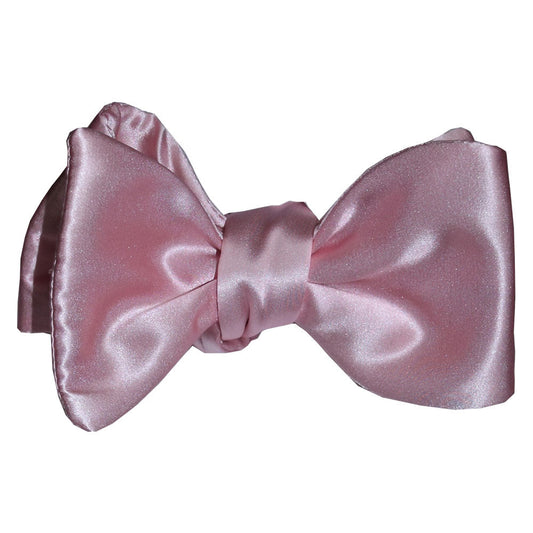 Pink silk "tie-yourself"  bow tie on a white background