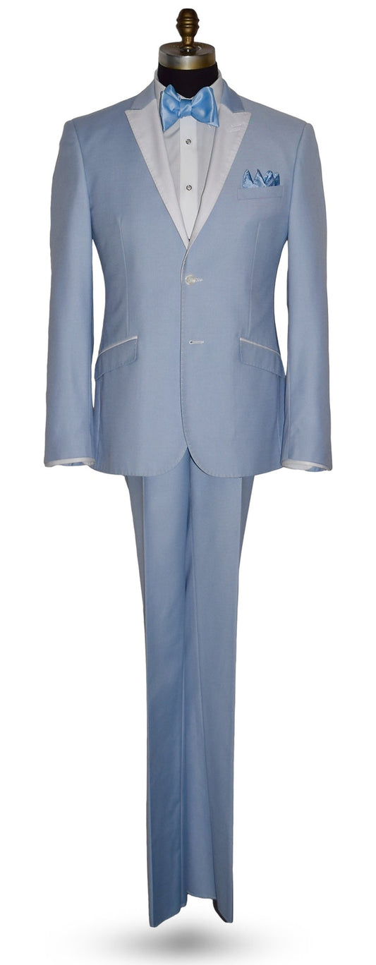 life size mannequin wearing a powder blue tuxedo with a blue bowtie against a white background