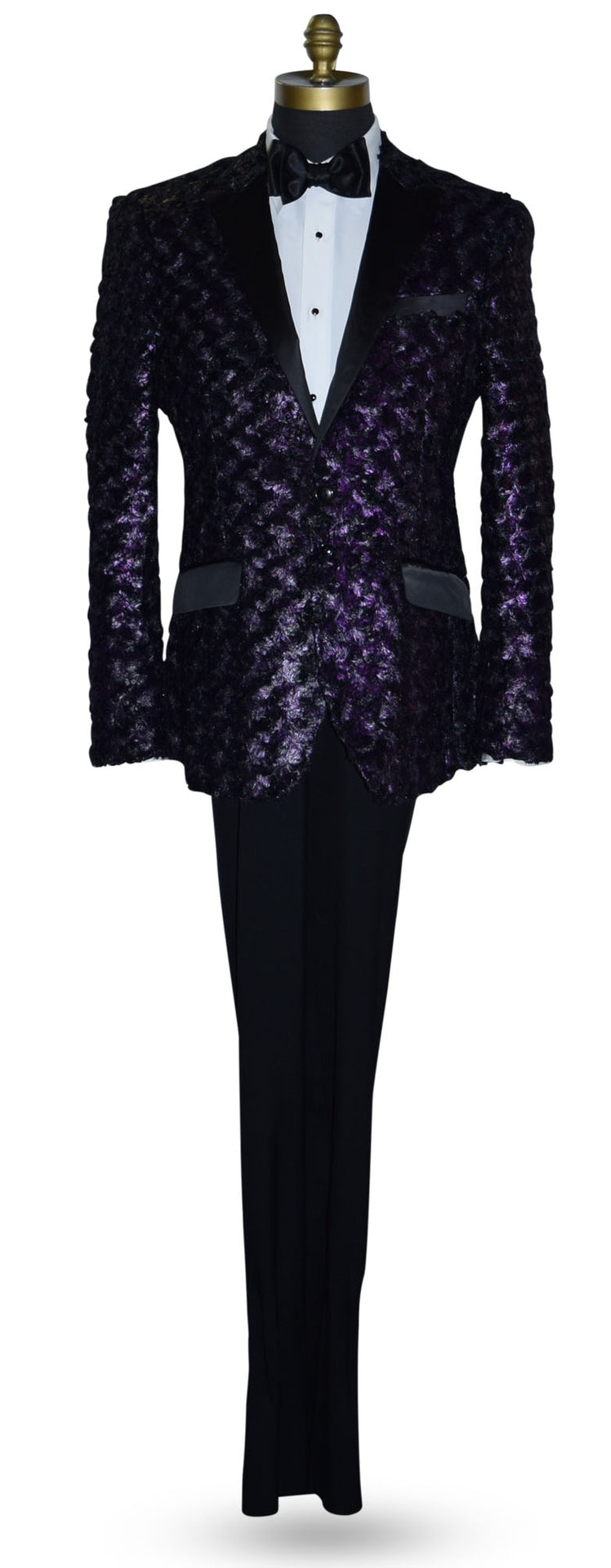 life size mannequin wearing a purple tuxedo with black lapels with a white tuxedo shirt and black bowtie against a white background
