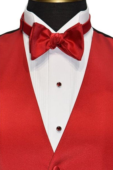 mannequin wearing. red vest and a red "self-tie" bowtie against a white background