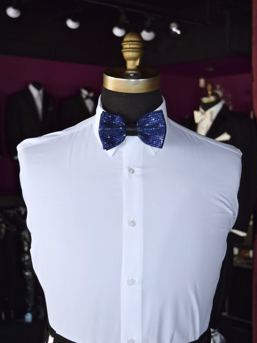 White dress shirt with a royal blue sequin bow tie on a mannequin against a dark background
