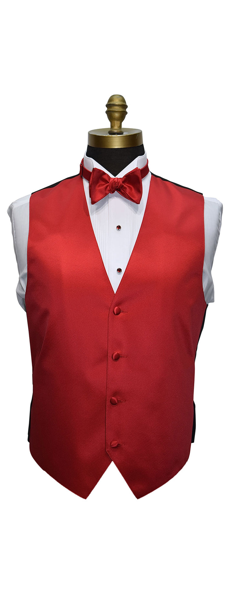 close-up mannequin wearing a white wing collar tuxedo shirt with a ruby-red bowtie and ruby-red tuxedo vest against a white background 
