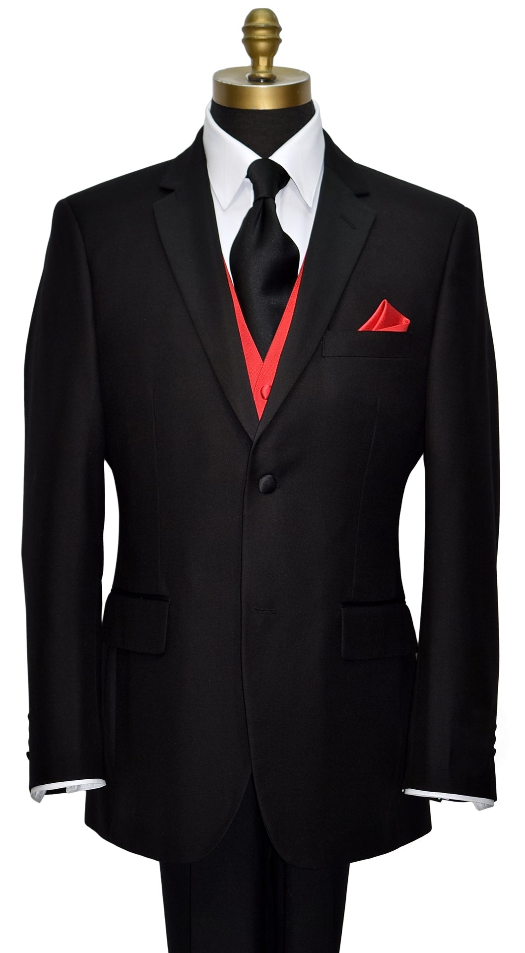 close-up mannequin wearing a black notch-lapel tuxedo with a white dress shirt with a black satin long necktie and ruby red vest and pocket handkerchief against a white background