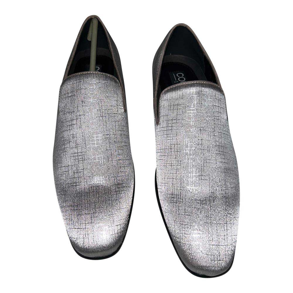 Pair of silver-gray mens loafers on a white background