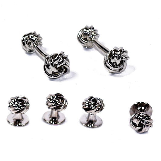 silver "love knot" studs and cufflinks against a white backgrounf