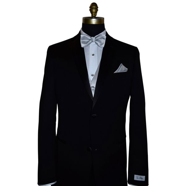 black tuxedo on display with a silver vest and silver pre-tied bowtie against a white background