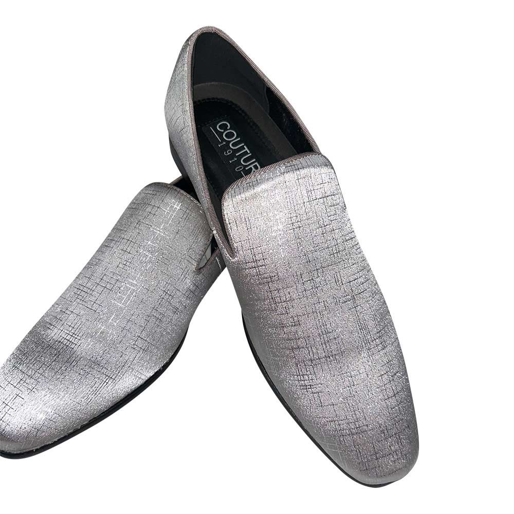 Pair of silver textured loafers on a white background