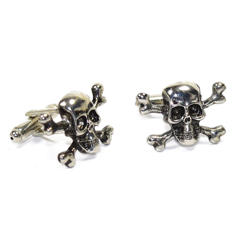 Silver skull and crossbones cufflinks on a white background