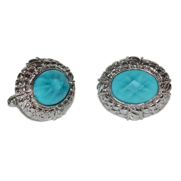 turquoise cufflinks with siver trim against a white background