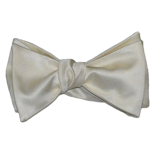 off-white "self-tie" bowtie against a white background 