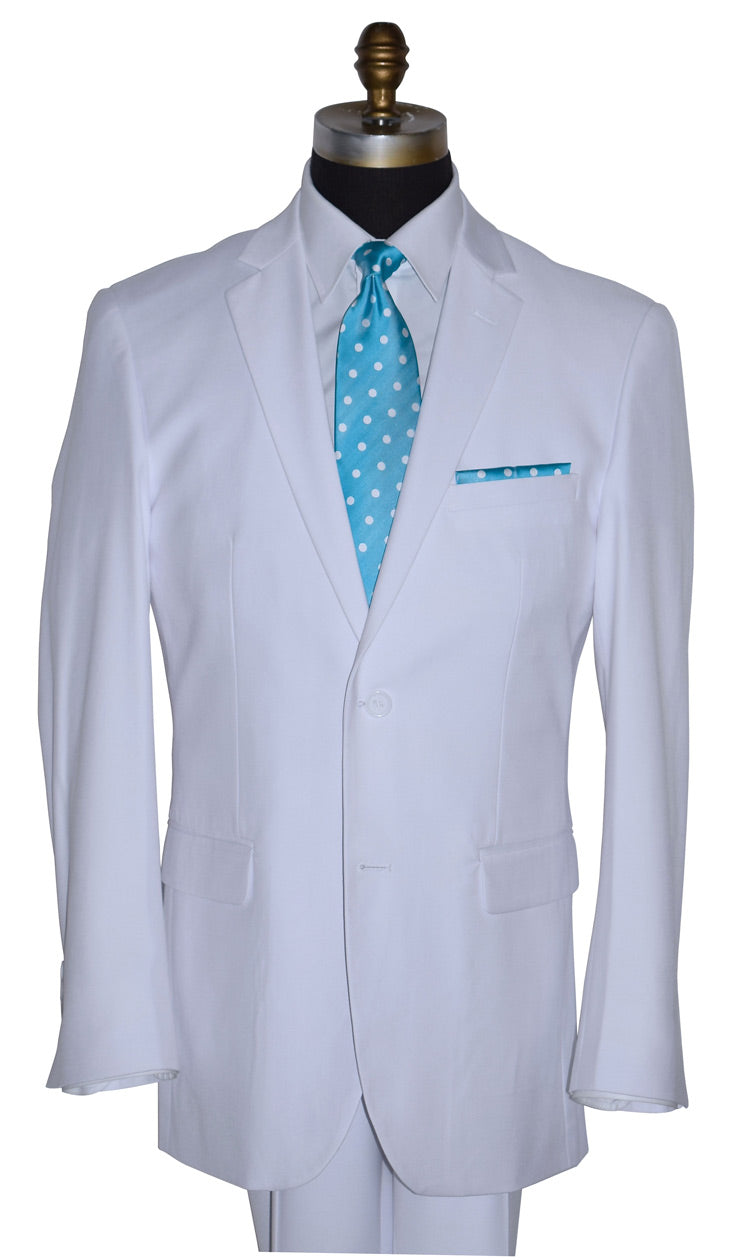 close up white suit with a blue tie with white polka-dost against a white background