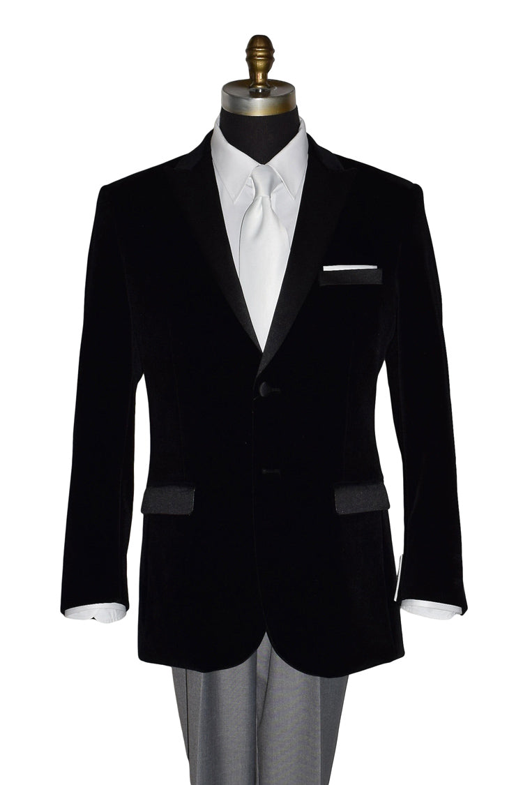 Black velvet tuxedo jacket with white shirt and white low-sheen necktie on a mannequin against a white background