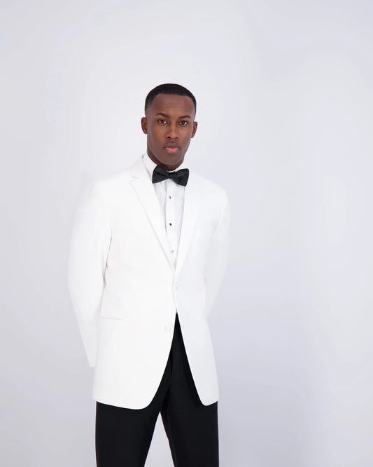 handsome black man wearing a white slim-fit notch lapel tuxedo with a black bow tie on a white background