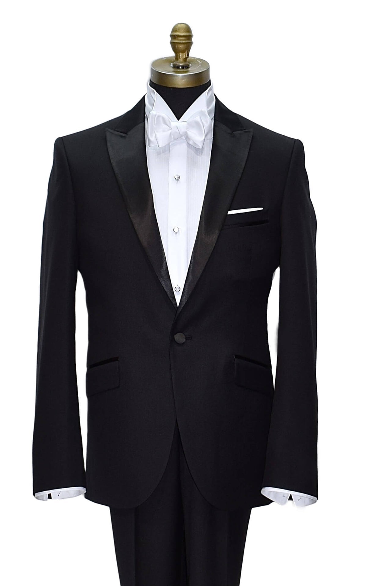 Black tuxedo with white shirt and white "tie-yourself" bow tie on a mannequin against a white background